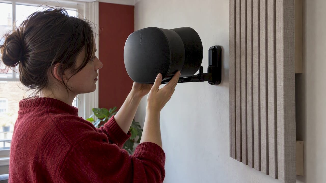Mounted speaker beside acoustic panel air gap